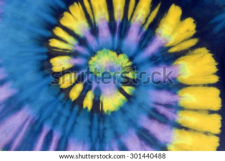 colourful tie dyed pattern on cotton fabric abstract background.

