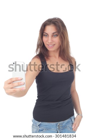 pretty young girl making selfie with the smartphone, focus on the phone