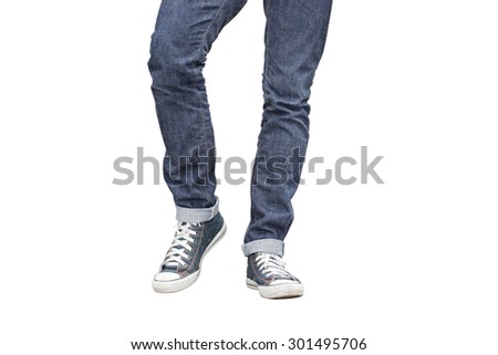 Regular Fit Straight Leg Jeans and Retro Canvas High Top Sneakers isolated on white background, selective focus (detailed close-up shot) Royalty-Free Stock Photo #301495706