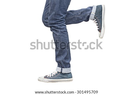 Regular Fit Straight Leg Jeans and Retro Canvas High Top Sneakers isolated on white background, selective focus (detailed close-up shot) Royalty-Free Stock Photo #301495709