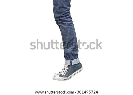Regular Fit Straight Leg Jeans and Retro Canvas High Top Sneakers isolated on white background, selective focus (detailed close-up shot) Royalty-Free Stock Photo #301495724