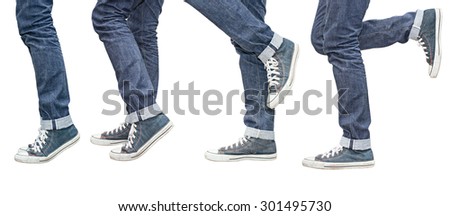Regular Fit Straight Leg Jeans and Retro Canvas High Top Sneakers isolated on white background, selective focus (detailed close-up shot) Royalty-Free Stock Photo #301495730