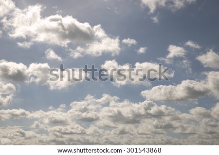 Abstract busy fluffy white cloud over blue sky background