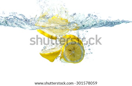 slice yellow lemon in water, motion action.