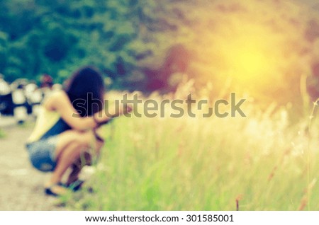 blurred women photography on grass field with process in vintage style