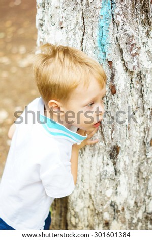 Portrait of beautiful boy with blue eyes outdoor