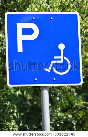 Disabled parking lot sign