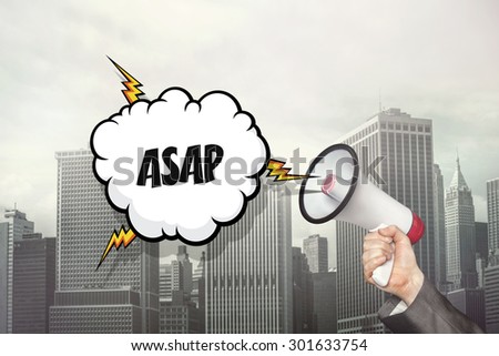  text on speech bubble and businessman hand holding megaphone on cityscape background