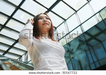 young asian businesswoman holding mobile phone