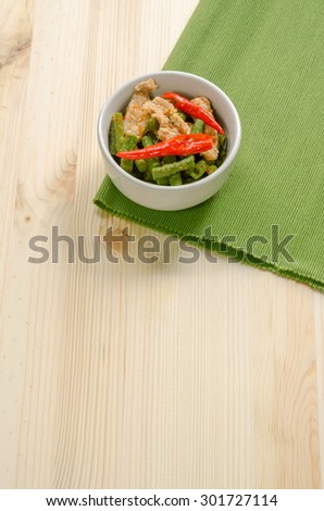 Spicy stir fried pork with red curry paste and Yard Long bean, Thai food menu