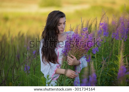 beautiful girl standing in a field, long beautiful hair, closed eyes