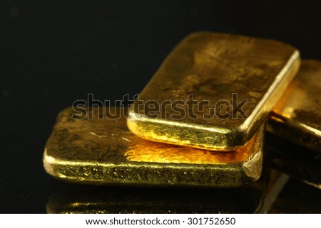 Gold bar put on the dark background represent the business concept related idea.