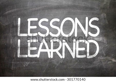 Lessons Learned written on a chalkboard Royalty-Free Stock Photo #301770140