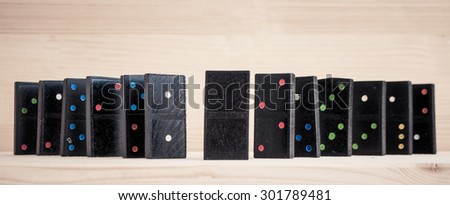 domino pieces on the brown wooden table background
