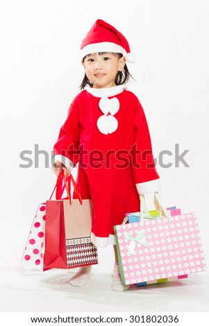 Asian Little Santa Claus with shopping bag in white isolated backgroundll