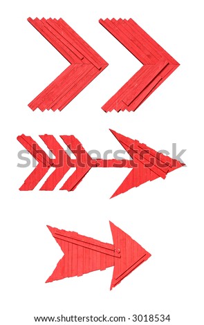 cutout of three large red arrow sign made of wood isolated on white