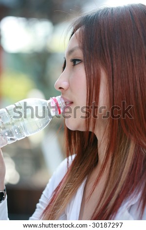 young asian women drinking water