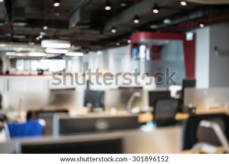 Abstract blur business office working space background with modern interior table and chair with devices. Blurry creative workplace design background. laptop and mouse