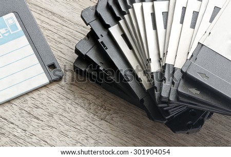 Stack of Used Floppy Diskettes  on Wooden table