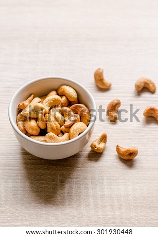 Close up cashew nuts on wooden background