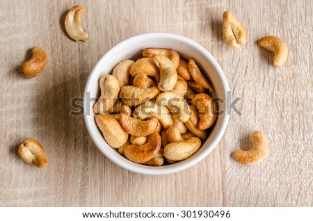 Close up cashew nuts on wooden background