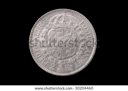 Swedish ancient silver coin (Emperpr Gustav V, 2 crowns, 1935). Reverse. Path on the black background.
