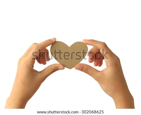 Woman hand holding paper heart isolated on white background