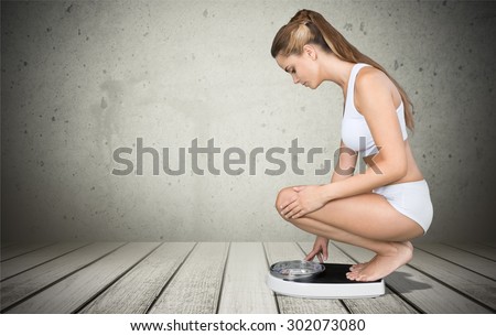 Weight Scale, Dieting, Women. Royalty-Free Stock Photo #302073080