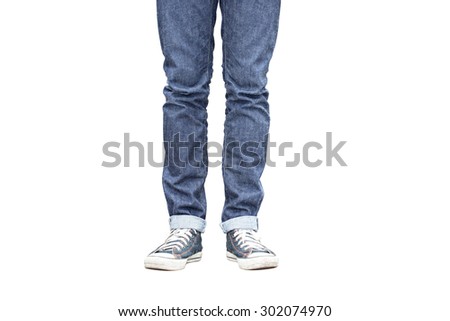 Regular Fit Straight Leg Jeans and Retro Canvas High Top Sneakers isolated on white background, selective focus (detailed close-up shot) Royalty-Free Stock Photo #302074970