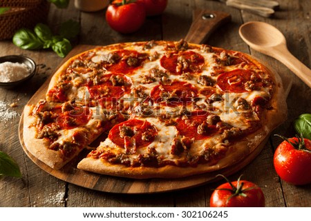 Homemade Meat Loves Pizza with Pepperoni Sausage and Bacon Royalty-Free Stock Photo #302106245