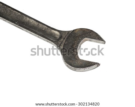Tools Aged rugged cast iron steel wrench isolated