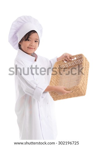 Little asian girl chef in uniform holding empty basket ,isolated on white background