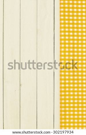 Checkered Tablecloth On The Wooden Background.