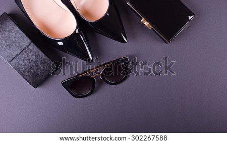 beautiful women's minimal set of fashion accessories on a white background. Ideal for blogs or magazines. On black background.