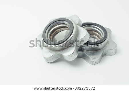 RUSTY AND DUSTY DUMBELL LOCK NUTS ISOLATED IN WHITE BACKGROUND