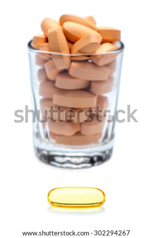 One capsule better than many pills. white background