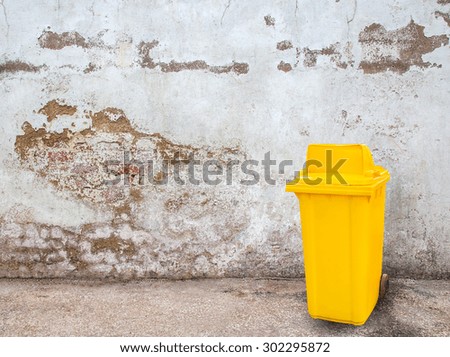 Yellow garbage bins on grunge background for any design