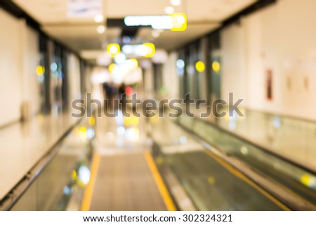 Passage in airport out of focus - Bokeh blur light background.