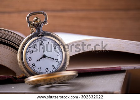Retro clock on text book 