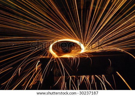sparks at grinding steel material