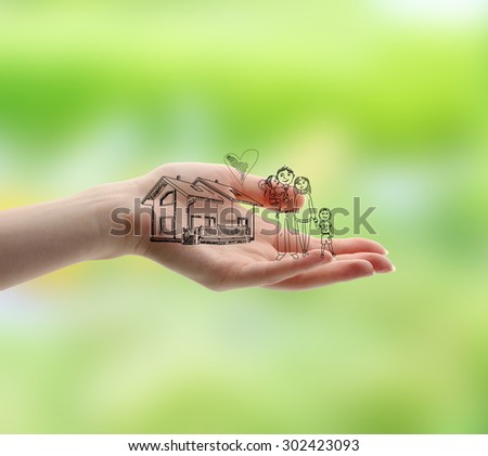 Female hand with drawings on nature background