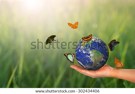 Blue Planet Earth on Hand - Elements of this image furnished by NASA