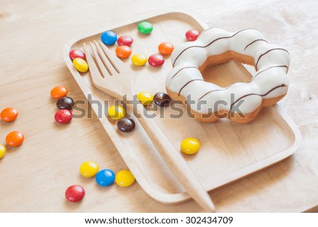 Donuts on wooden background