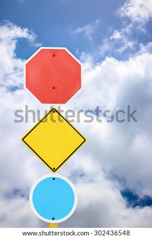 directional signage on blue sky and cloud background.