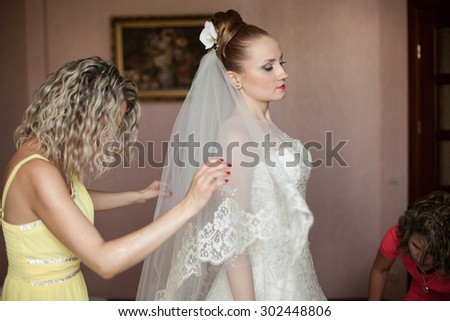 stylish gorgeous young beautiful bride prepares for wedding ceremony