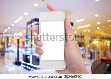 Taking picture with mobile, smart phone in shopping mall.