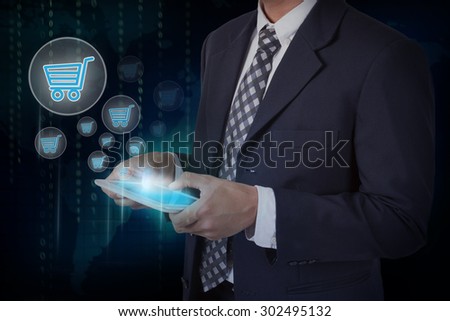 Businessman hand touch online shopping icons on a tablet