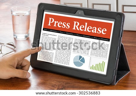 A tablet computer on a desk - Press Release Royalty-Free Stock Photo #302536883
