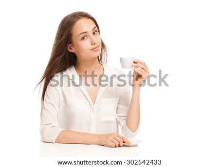 Portrait of a gorgeous young brunette woman having a cup of espresso coffee.