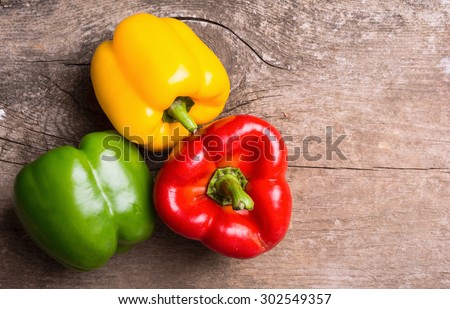 Green , yellow and red bell pepper background Royalty-Free Stock Photo #302549357